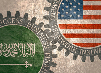 Partnership concept. USA and Saudi Arabia association. Gears textured by flag. Business relative words on the mechanism of gears. Communication concept in industrial design.