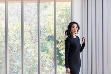 Fototapeta premium Asian model woman posing near big windows..