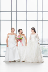 Group of beautiful Asian brides standing and smile..