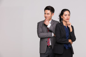 Two business people standing and posing..