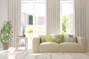 Stylish room in white color with sofa and summer landscape in window. Scandinavian interior design. 3D illustration