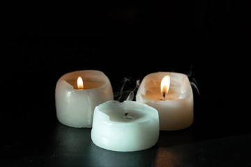 Fototapeta na wymiar mourning candles on black background