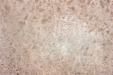 Texture of a concrete wall with cracks and scratches which can be used as a background