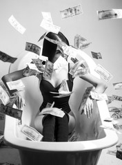 Sexy female and dollar bills. Woman with lot of money. Millionaire woman lying in bedroom. Sexy woman lying in dollar bills. Rich sexy woman lies on money. Currency, women, winning. Bank concept.