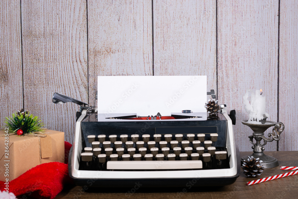 Fototapete retro typewriter with a blank sheet of paper for text. new year and christmas background mock up, co