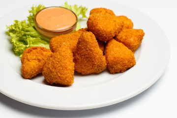 deep fried cheese slices with a sauce