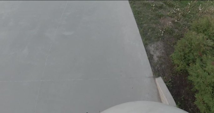 First person view of a BMXer griding a handrail at skatepark - extreme sports