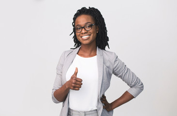 Successful Afro Business Woman Gesturing Thumbs-Up Over White Background