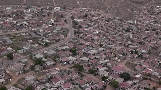 Birdseye view of low cost RDP housing settlement and shacks in township of South Africa.