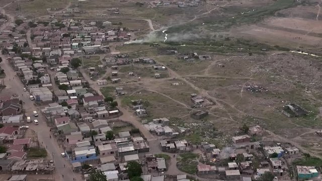 Aerial shot of large low cost RDP housing in township of South Africa at end of day.