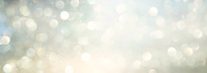 Fototapeta na wymiar background of abstract glitter lights. silver and gold. de-focused. banner