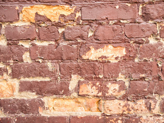 Background in the form of an old brick wall with peeling paint