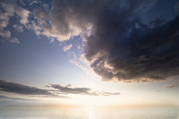 Naklejka na ściany i meble dramatic cloud over North sea at sundown