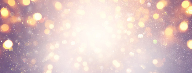 abstract glitter silver, purple, blue and gold lights background. de-focused. banner