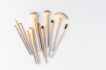 Makeup brushes set isolated on white background. Top view