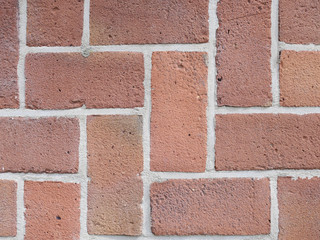 pattern of red colored brickwork on horizontal and vertical lines