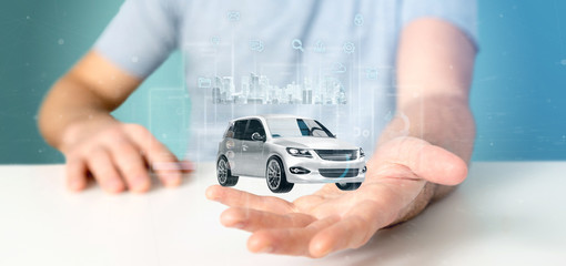 Businessman holding Dashboard smartcar interface with multimedia icon and city map on a background 3d rendering