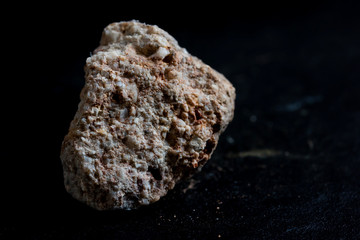 conglomerate stone isolate on black background