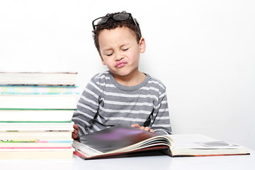 child reading book at school been educated on white background stock images stock photo