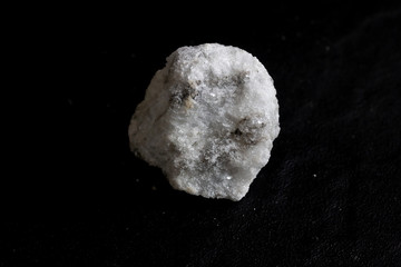 Gypsum(alabaster) stone isolate on black background