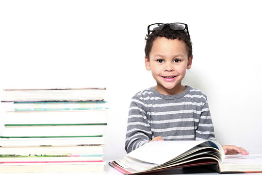 child reading book at school been educated on white background stock images stock photo