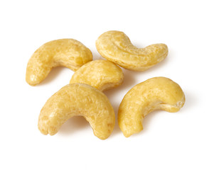 raw cashew in a glass jar isolated on white