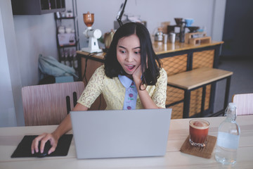 Fototapeta premium girl showing excites feeling with laptop 