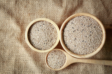 raw sesame on wooden bowl for healthy ingredient in cooking 