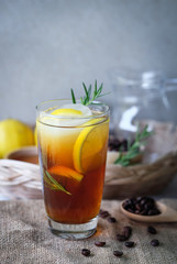 Americano iced coffee with lemon and rosemary for healthy drinking 
