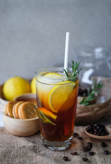Americano iced coffee with lemon and rosemary for healthy drinking 