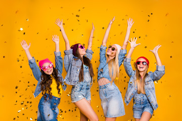 Photo of four crazy charming nice glad in denim clothes skirts ladies having disco weekend holidays rest chill relax isolated yellow background