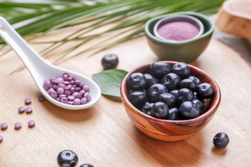 Acai berries with tablets on board