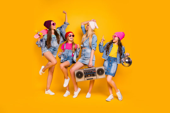 Full body size photo of crazy carefree beautiful lifestyle feeling cool wearing denim clothes people dancers millennials chilling out having rest on weekend isolated yellow background