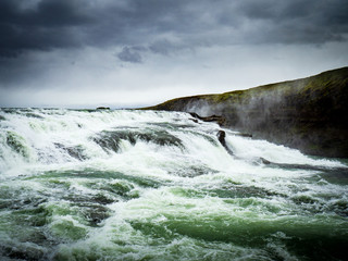 Fototapeta na wymiar Gullfoss waterfall with dark clouds in Iceland