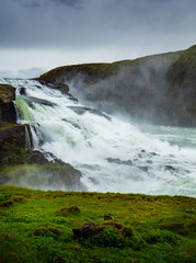 Gullfoss waterfall with dark clouds in Iceland