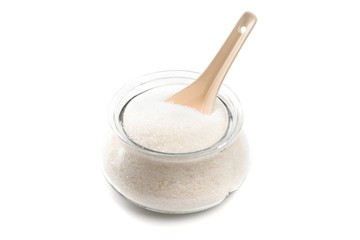Sugar in  glass bowl on white background  top view