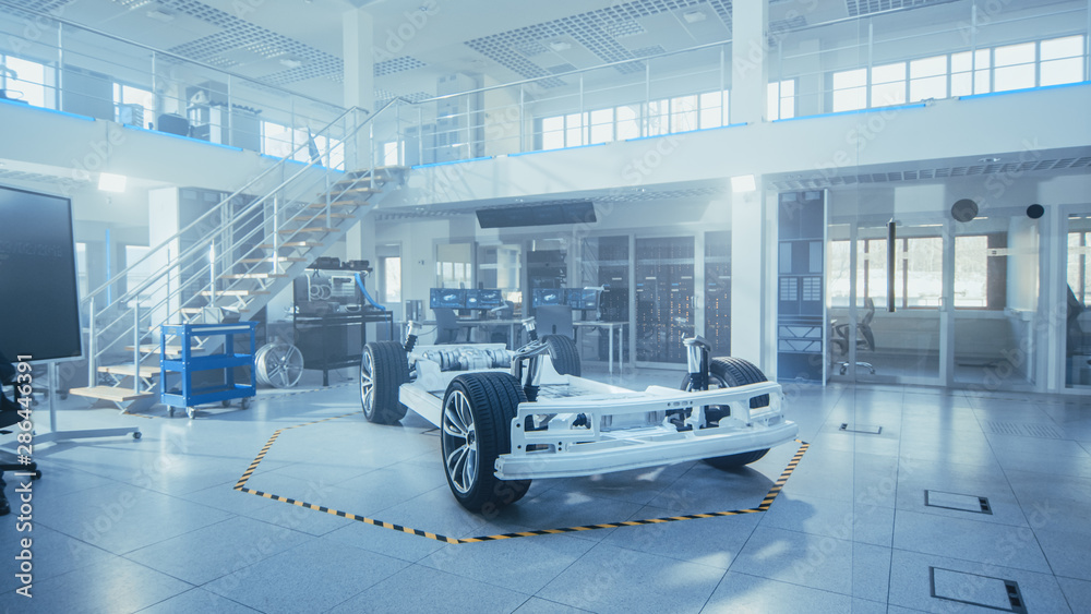 Leinwandbilder concept of authentic electric car platform chassis prototype standing in high tech industrial machin