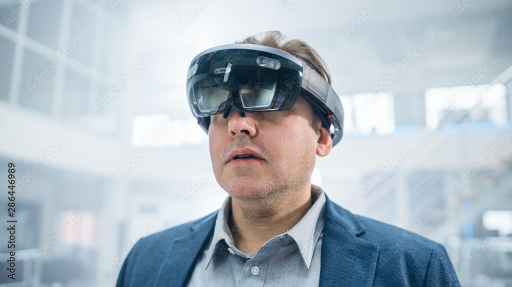 Poster Female Engineer Using Augmented Reality Headset. and Moving Virtual Pieces in the Air. In Innovation High Tech Laboratory Facility with Futuristic Atmosphere.