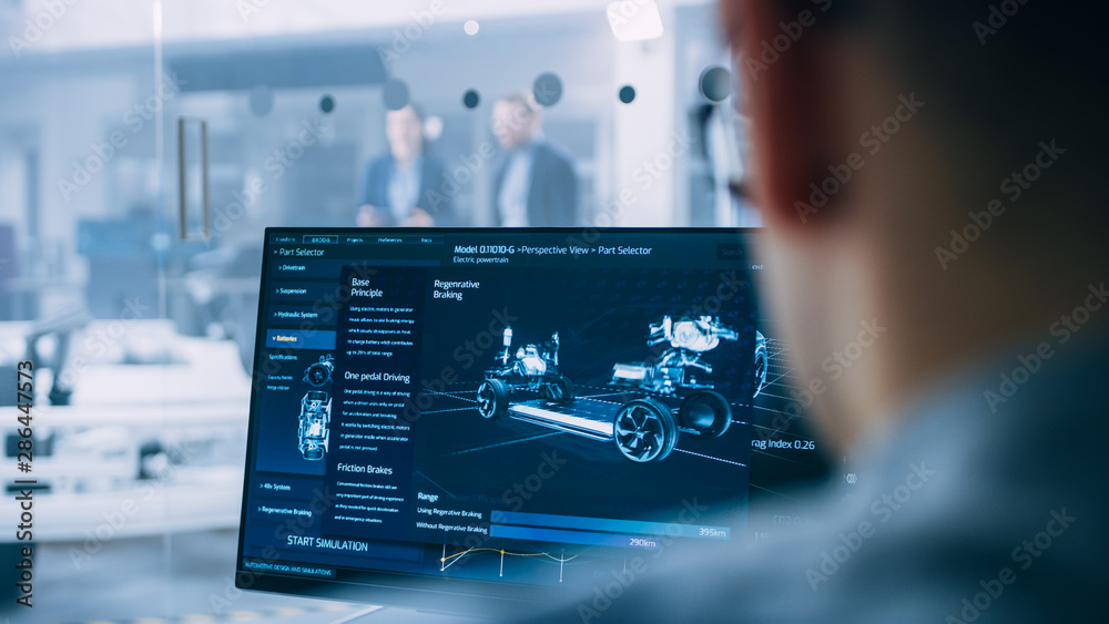 Poster professional engineer works on a computer with a 3d cad software and tests the electric car chassis 