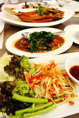 Thai food on table, Spicy salad and Fried fish
