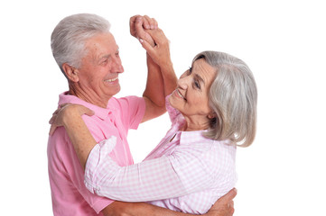 senior couple dancing isolated on white background, full length