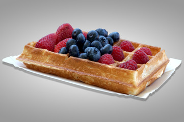 Waffle with fruits - strawberries, blueberries and raspberries
