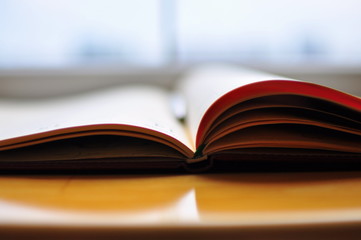 open book on wooden table