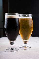 Dark and light beer glasses on a table