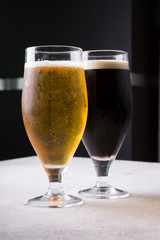 Dark and light beer glasses on a table