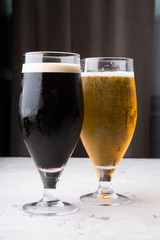 Dark and light beer glasses on a table