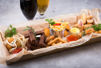 Different beer snacks served on a platter