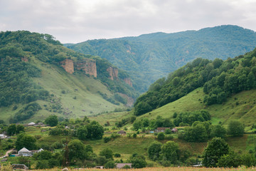 Fototapeta premium Landscape. View of the green valley among the mountains
