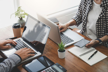 Business team casual collaboration discussing working analysis with financial data and marketing growth report graph in team, Meeting Talking Brainstorming Communication Concept