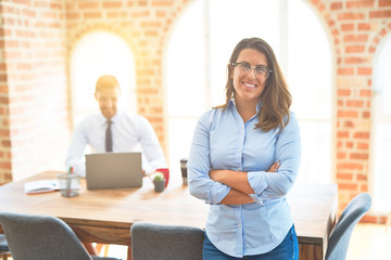 Young business team working at the office, head office woman standing smilig positive with crossed arms